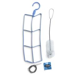 US CamelBak Reservoir Cleaning Kit, Unissued. Included in the package are the reservoir brush, flexible tube brush, drying hanger, and two cleaning tabs.
